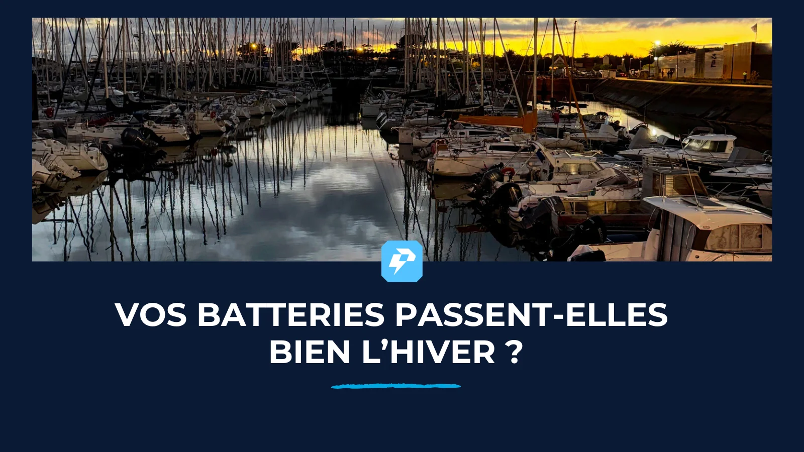 Port de plaisance en hiver à la tombée du jour, avec le titre « Vos batteries passent-elles bien l'hiver ?